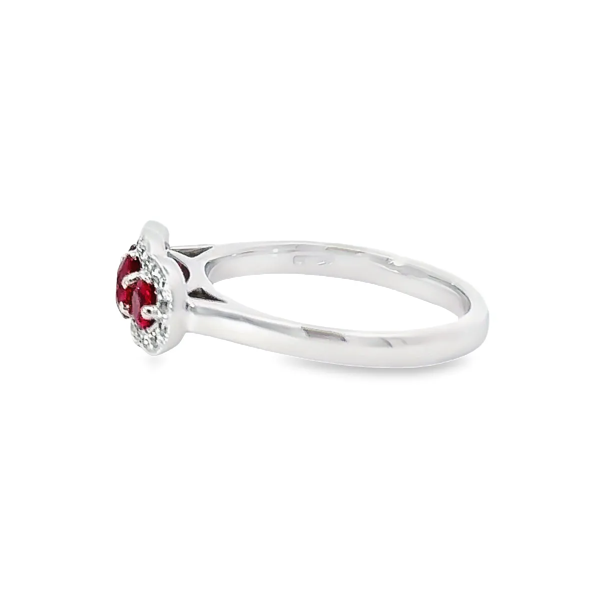 Platinum Ruby and diamond three stone halo ring