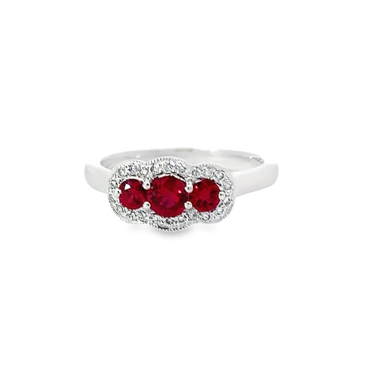 Platinum Ruby and diamond three stone halo ring